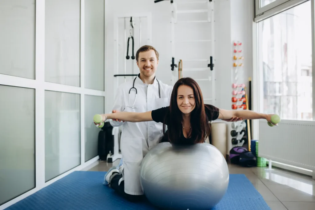 young fitness woman doing kinesiotherapy rehabilit 2023 11 27 05 14 49 utc